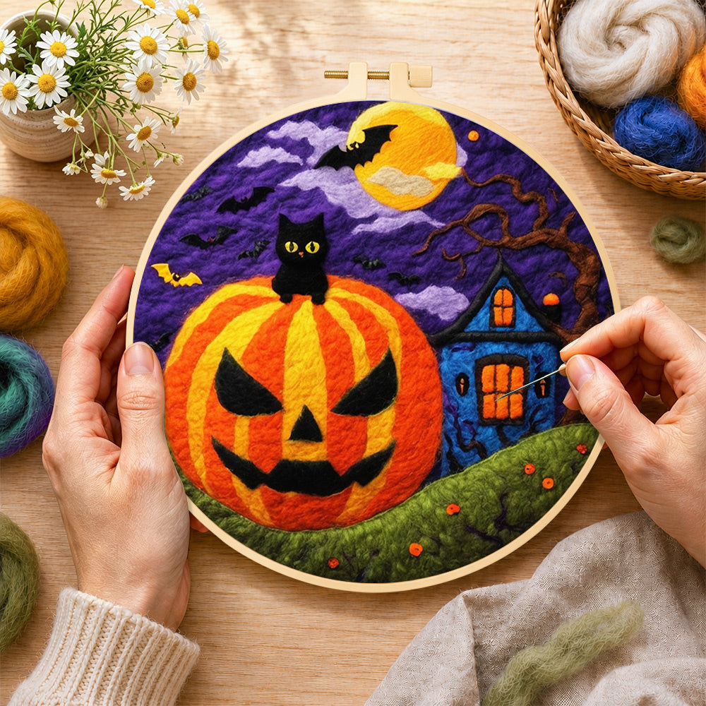Creating the jack-o'-lantern and haunted house wool painting by hand with a felting needle