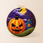 Jack-o'-lantern and haunted house needle felting kit for beginners with a round wooden frame