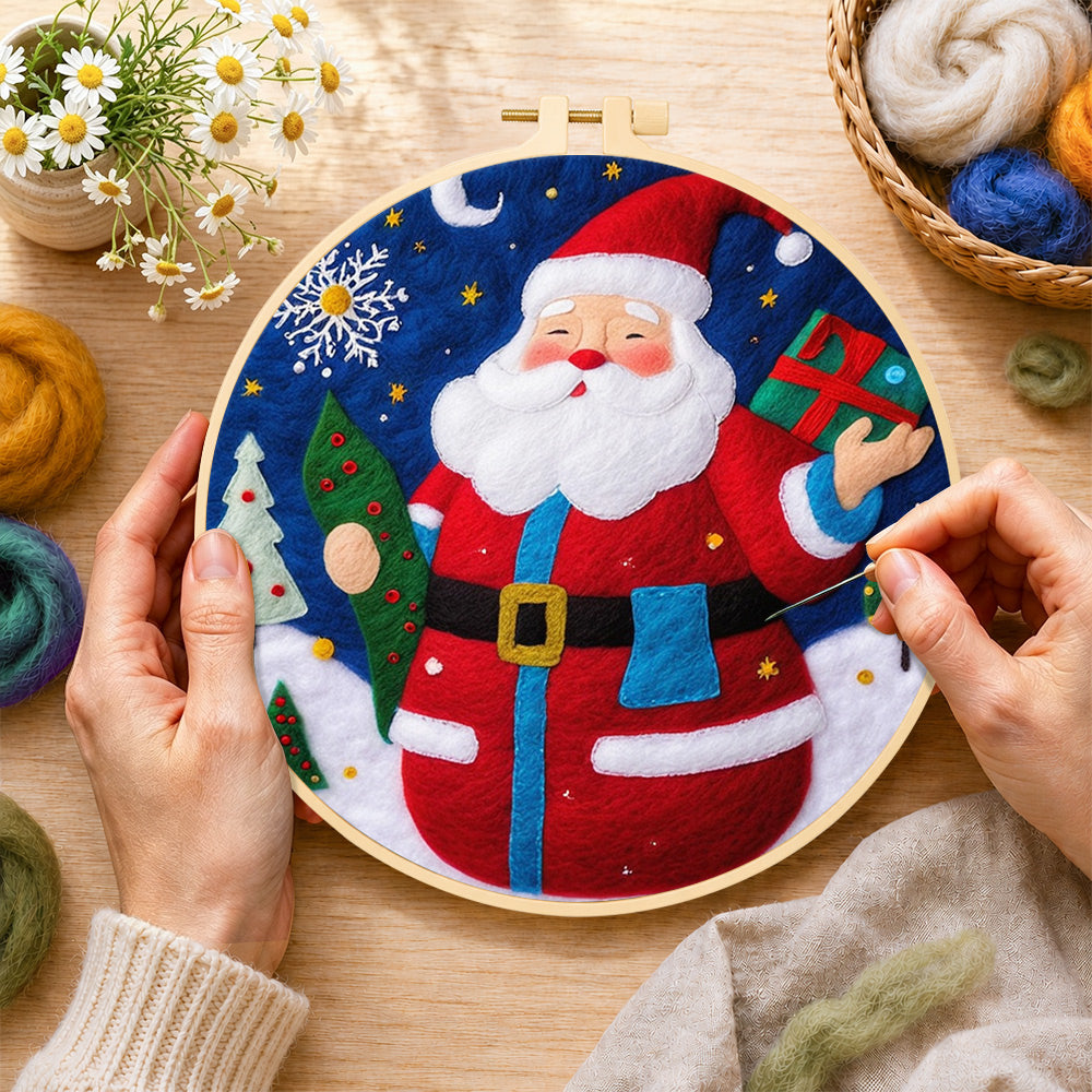Creating the jolly santa holding gift and tree wool painting by hand with a felting needle