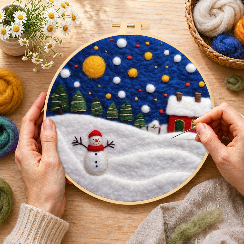 Creating the jolly snowman and red winter cottage wool painting by hand with a felting needle