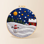Jolly snowman and red winter cottage needle felting kit for beginners with a round wooden frame