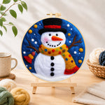 Finished jolly snowman with top hat and scarf needle felting displayed on a wooden easel