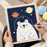 Creating handmade kawaii astronaut bear punch needle artwork