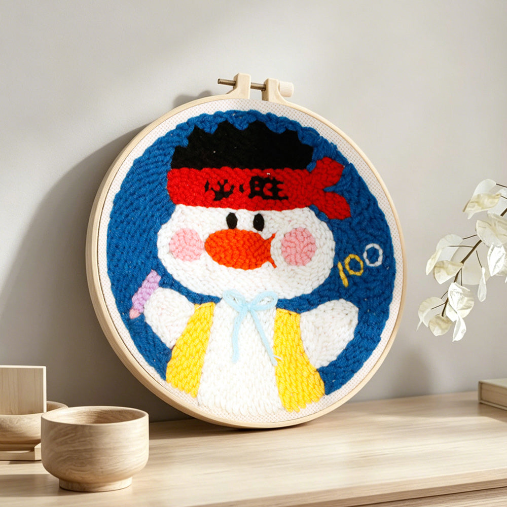 Kawaii fighter duck punch needle artwork displayed on a table