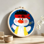 Kawaii fighter duck punch needle artwork displayed on a table