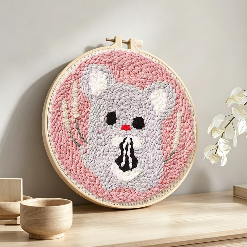 Kawaii mouse punch needle artwork displayed on a table