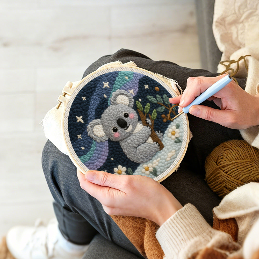 Creating handmade koala and mountains under the stars punch needle artwork