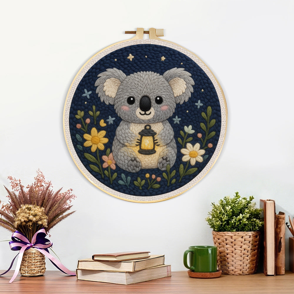 Finished koala and wildflowers artwork displayed on a wall