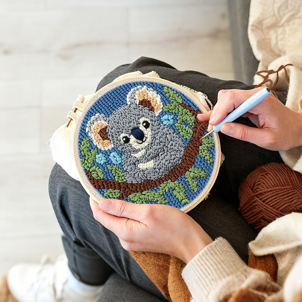 Creating handmade koala on a tree branch punch needle artwork