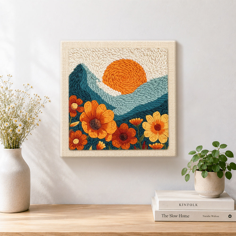 Finished large marigold flowers and setting sun artwork displayed on a wall