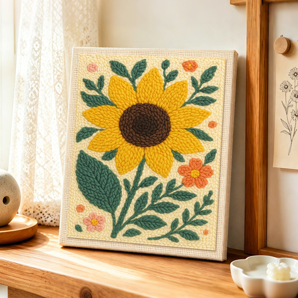 Large sunflower and ditsy florals punch needle artwork displayed on a table