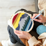 Creating handmade layered mountain landscape punch needle artwork