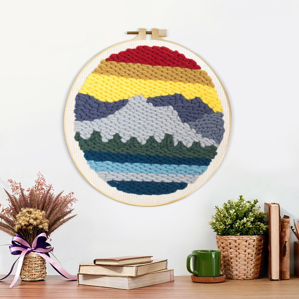 Finished layered mountain landscape artwork displayed on a wall