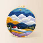 Layered mountains and red-roof cottage needle felting kit for beginners with a round wooden frame
