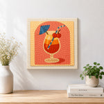 Finished layered tropical cocktail artwork displayed on a wall