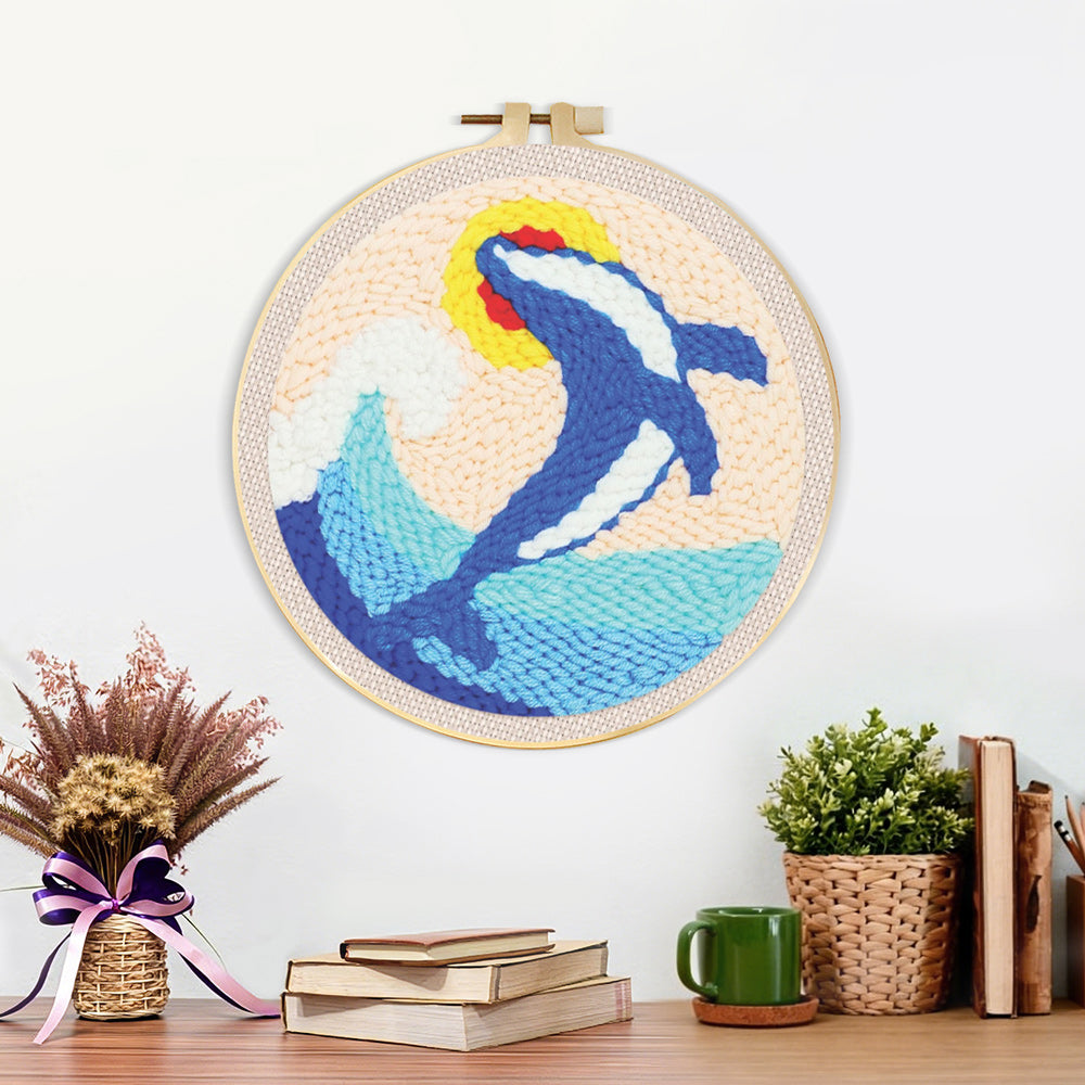 Finished leaping dolphin and waves artwork displayed on a wall