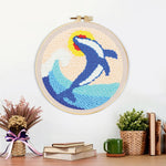 Finished leaping dolphin and waves artwork displayed on a wall