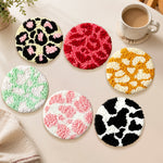 Leopard print and cow print punch needle coasters used for home decoration