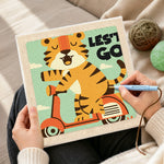 Creating handmade "LET'S GO" tiger on scooter punch needle artwork