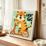 "LET'S GO" tiger on scooter punch needle artwork displayed on a table