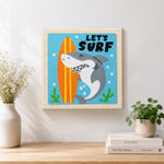 Finished "LET'S SURF" shark with surfboard artwork displayed on a wall