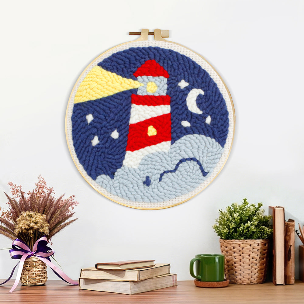 Finished lighthouse at night artwork displayed on a wall