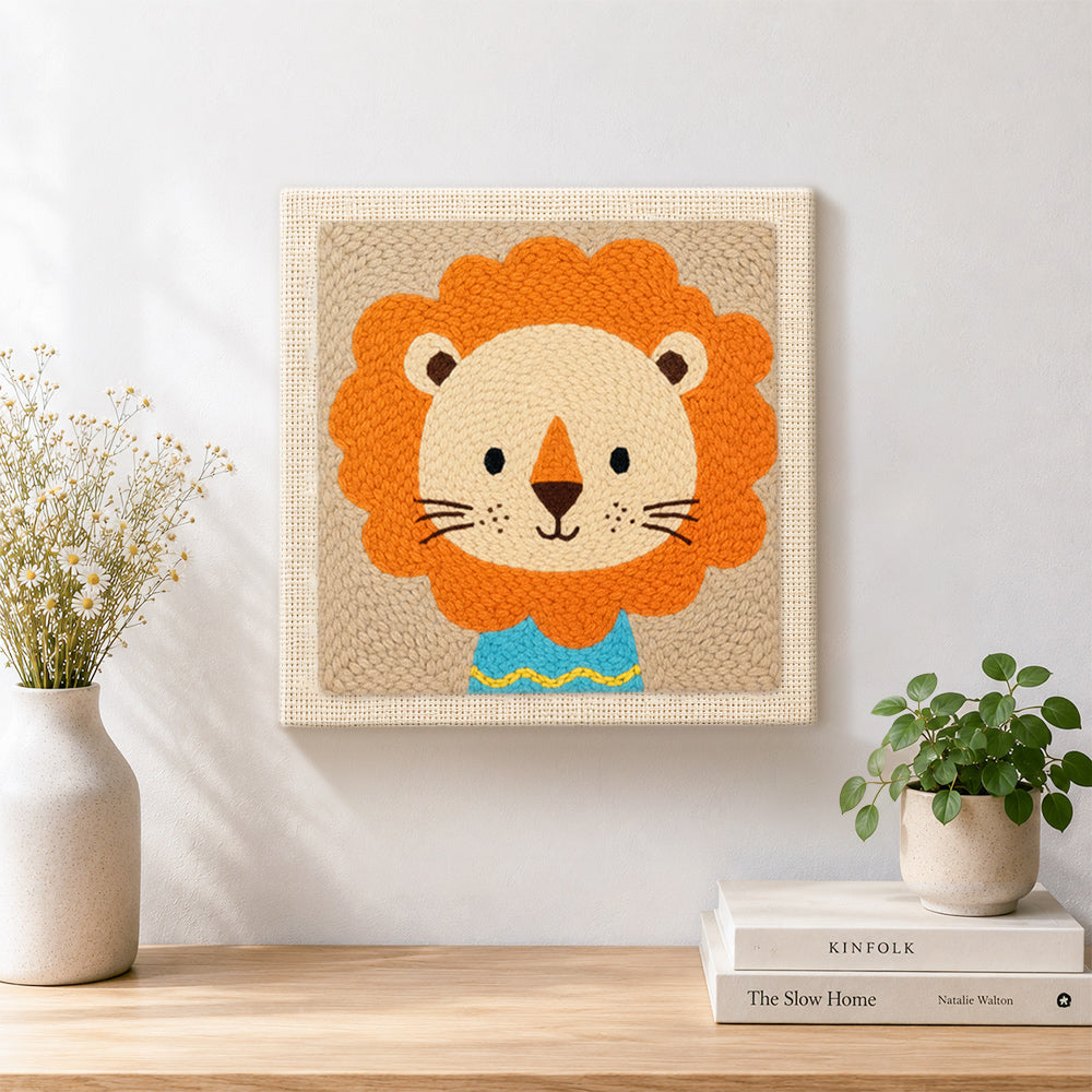 Finished lion in blue shirt artwork displayed on a wall