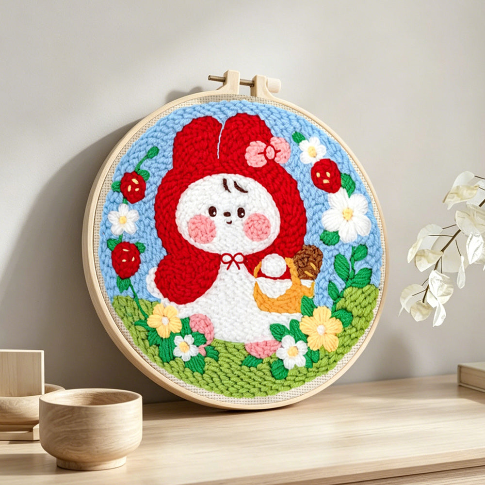 Little red riding hood bunny punch needle artwork displayed on a table