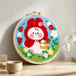 Little red riding hood bunny punch needle artwork displayed on a table