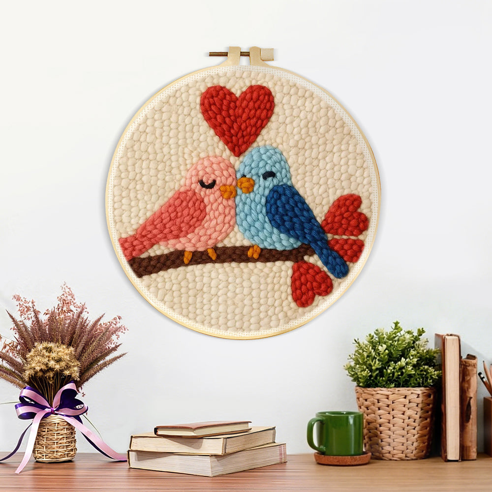 Finished lovebirds and hearts artwork displayed on a wall