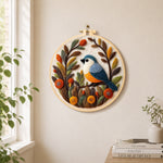 Lovely bird in autumn foliage needle felt wall art displayed in a bright home interior