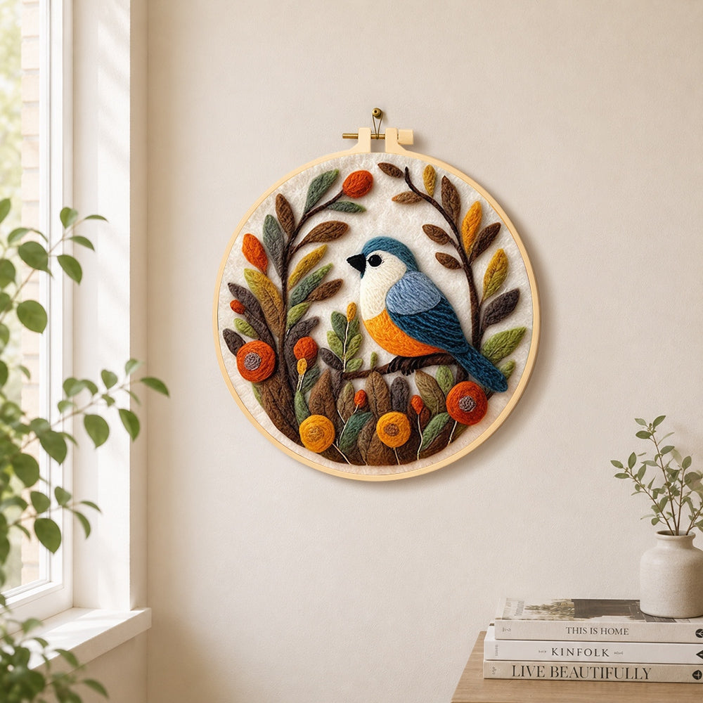 Lovely bird in autumn foliage needle felt wall art displayed in a bright home interior