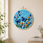 Lovely blue butterflies and flowers needle felt wall art displayed in a bright home interior