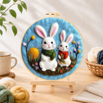 Finished lovely bunny pair with scarves needle felting displayed on a wooden easel