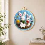 Lovely bunny pair with scarves needle felt wall art displayed in a bright home interior