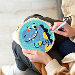 Creating handmade lucky blue dinosaur punch needle artwork