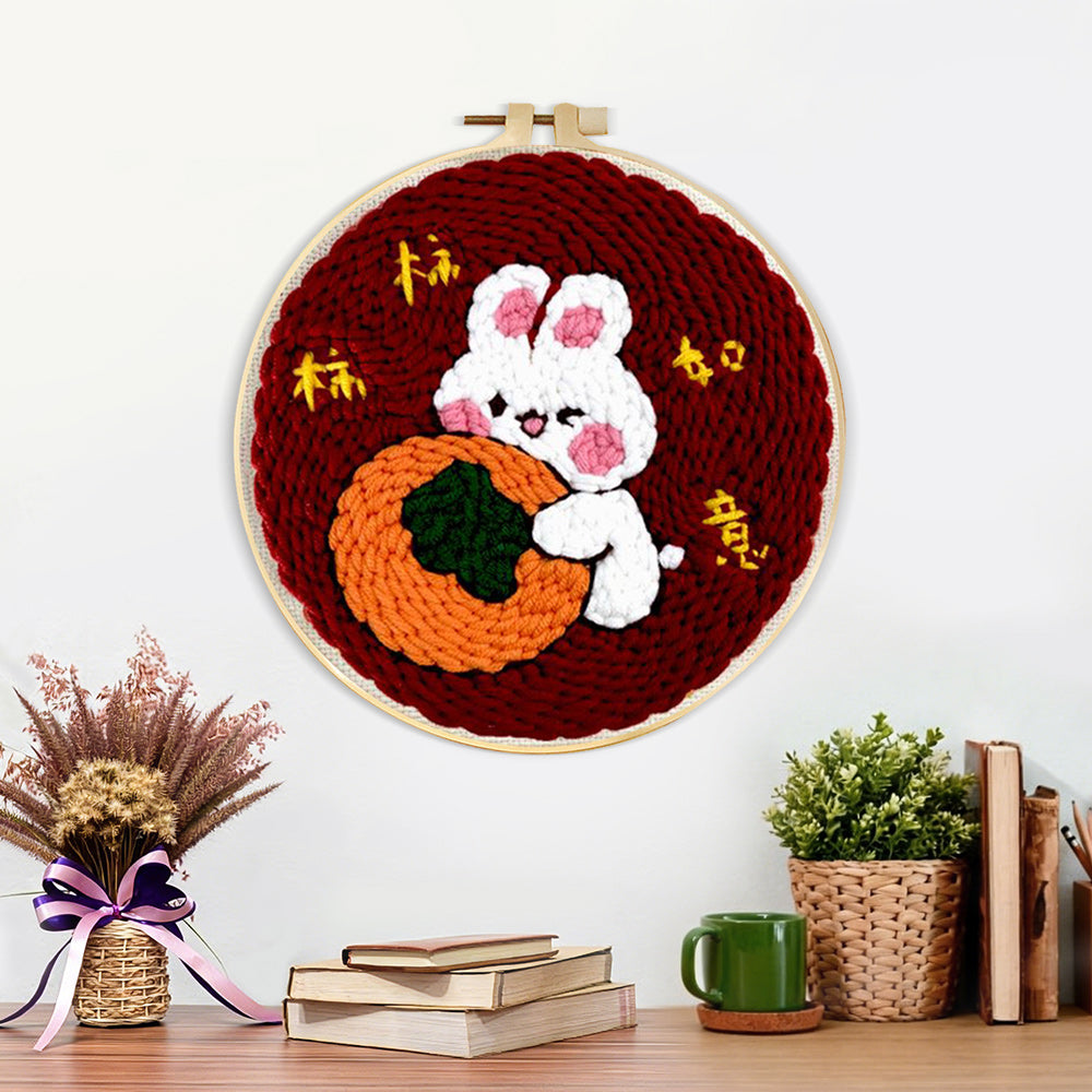 Finished lucky bunny hugging an orange artwork displayed on a wall