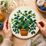 Creating the lush green potted plant wool painting by hand with a felting needle