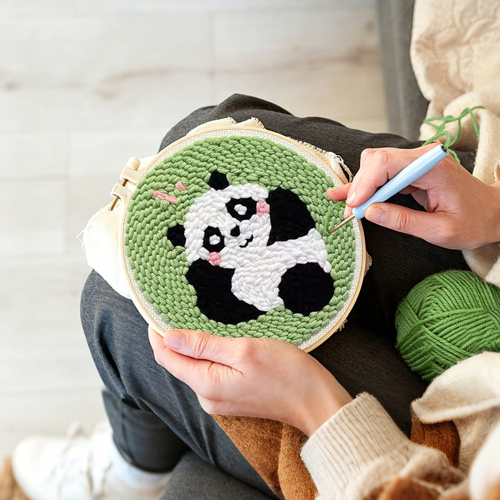 Creating handmade lying panda punch needle artwork