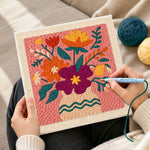 Creating handmade magenta and orange bouquet punch needle artwork