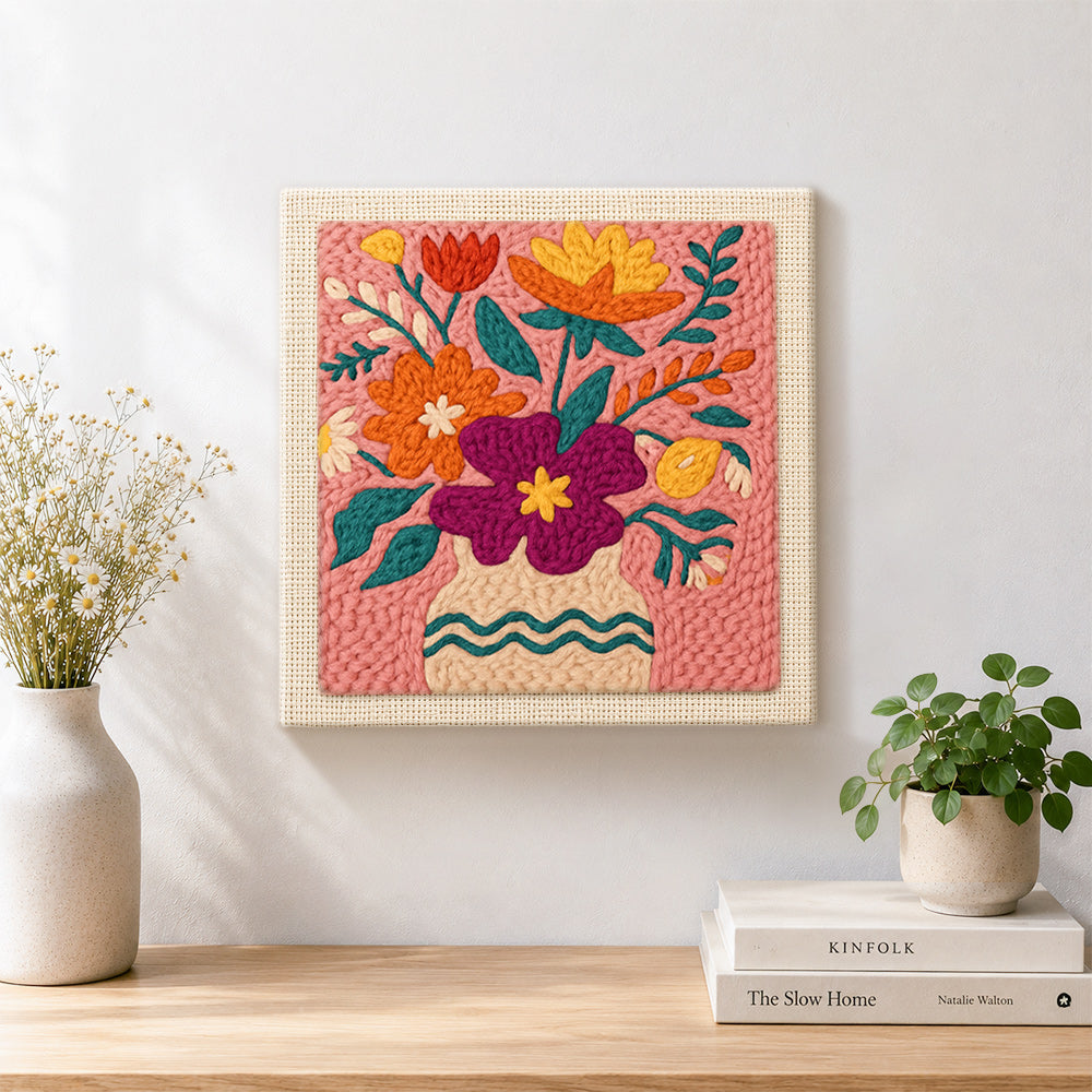 Finished magenta and orange bouquet artwork displayed on a wall