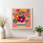 Finished magenta and orange bouquet artwork displayed on a wall