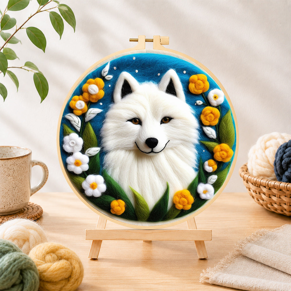 Finished magical white arctic fox and flowers needle felting displayed on a wooden easel
