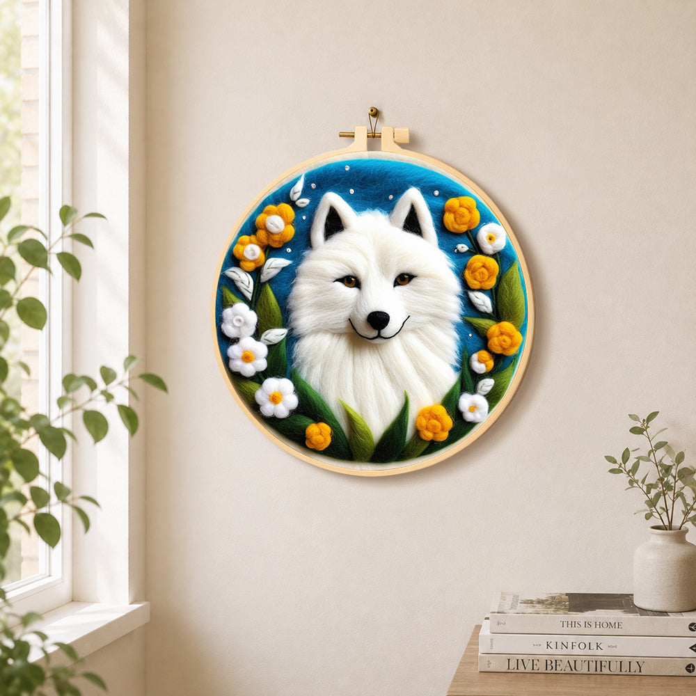 Magical white arctic fox and flowers needle felt wall art displayed in a bright home interior
