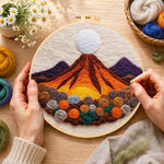 Creating the magma volcano and roses wool painting by hand with a felting needle