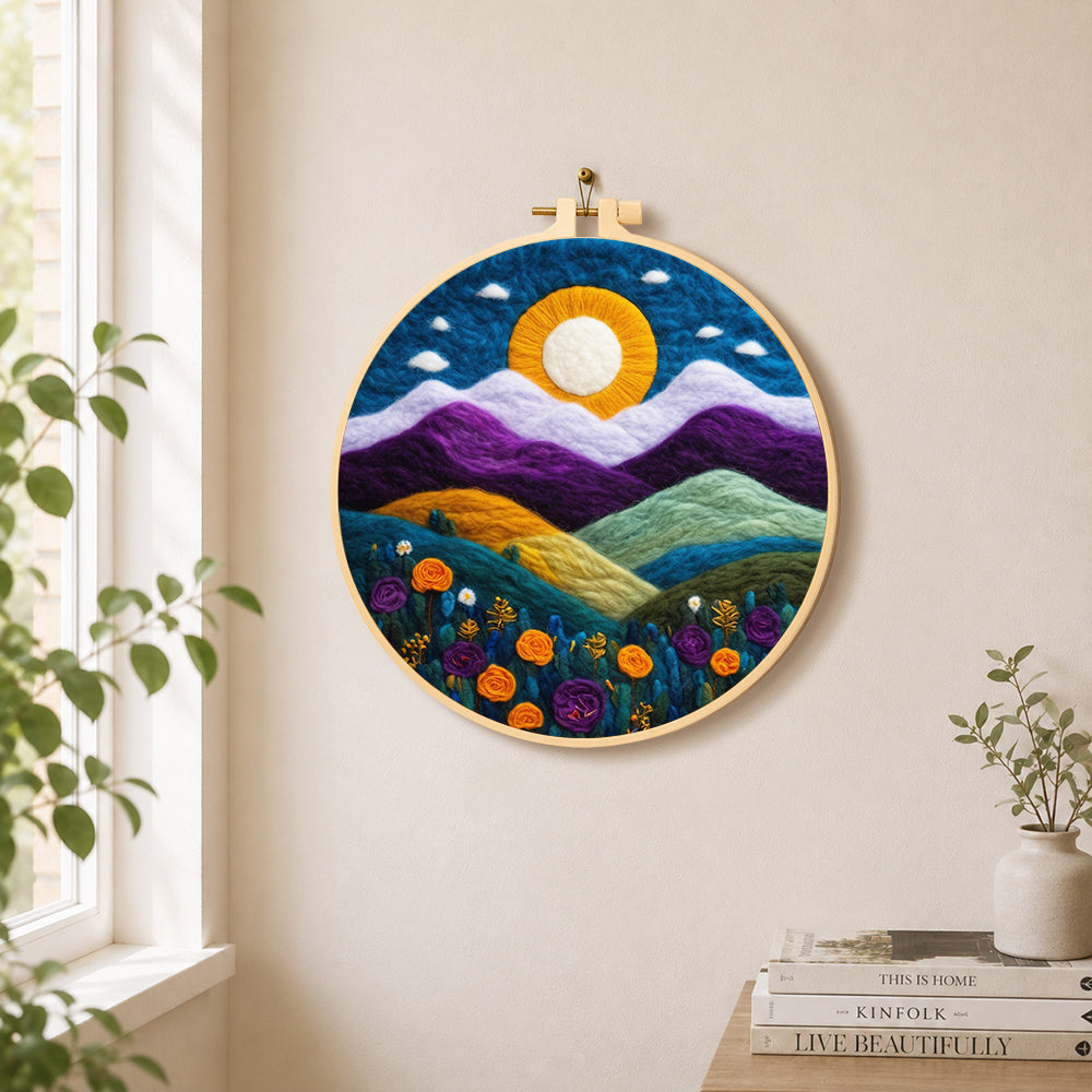 Magnificent mountains and sunset needle felt wall art displayed in a bright home interior