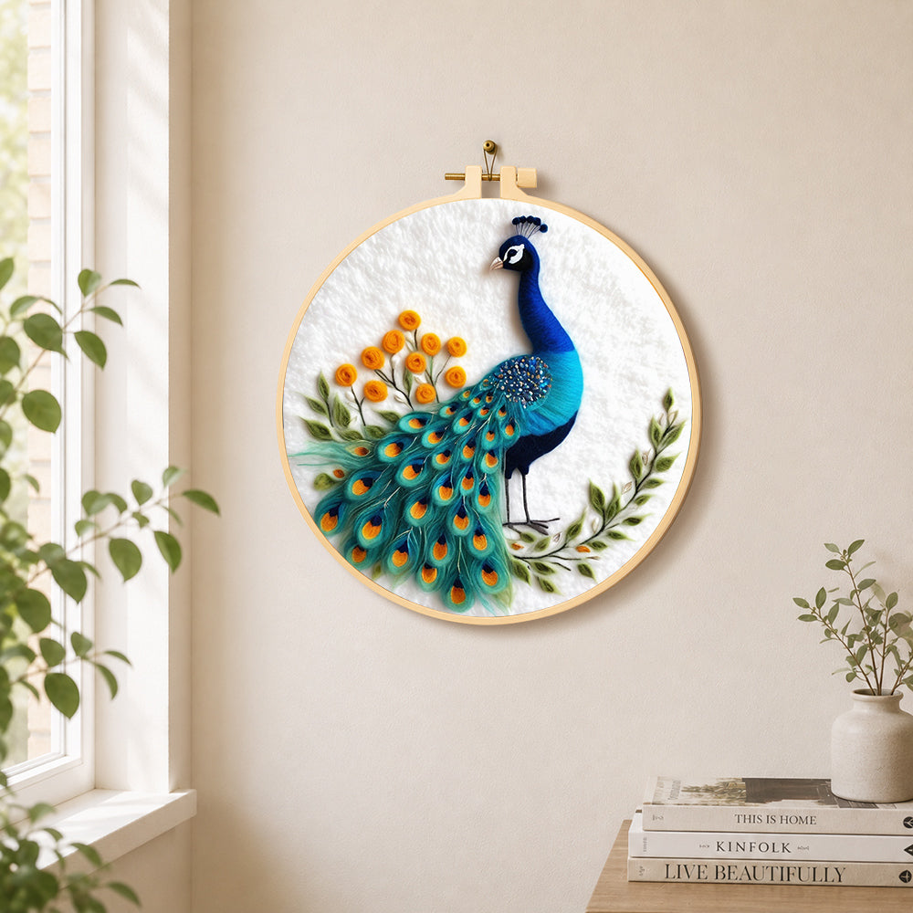 Majestic blue peacock needle felt wall art displayed in a bright home interior