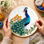 Creating the majestic blue peacock wool painting by hand with a felting needle