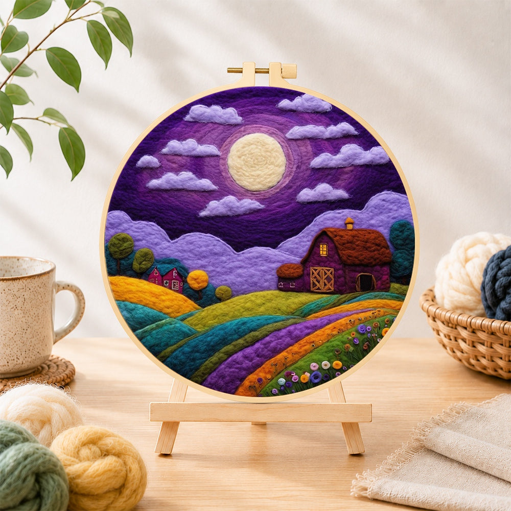 Finished majestic full moon and purple barn needle felting displayed on a wooden easel