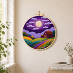Majestic full moon and purple barn needle felt wall art displayed in a bright home interior